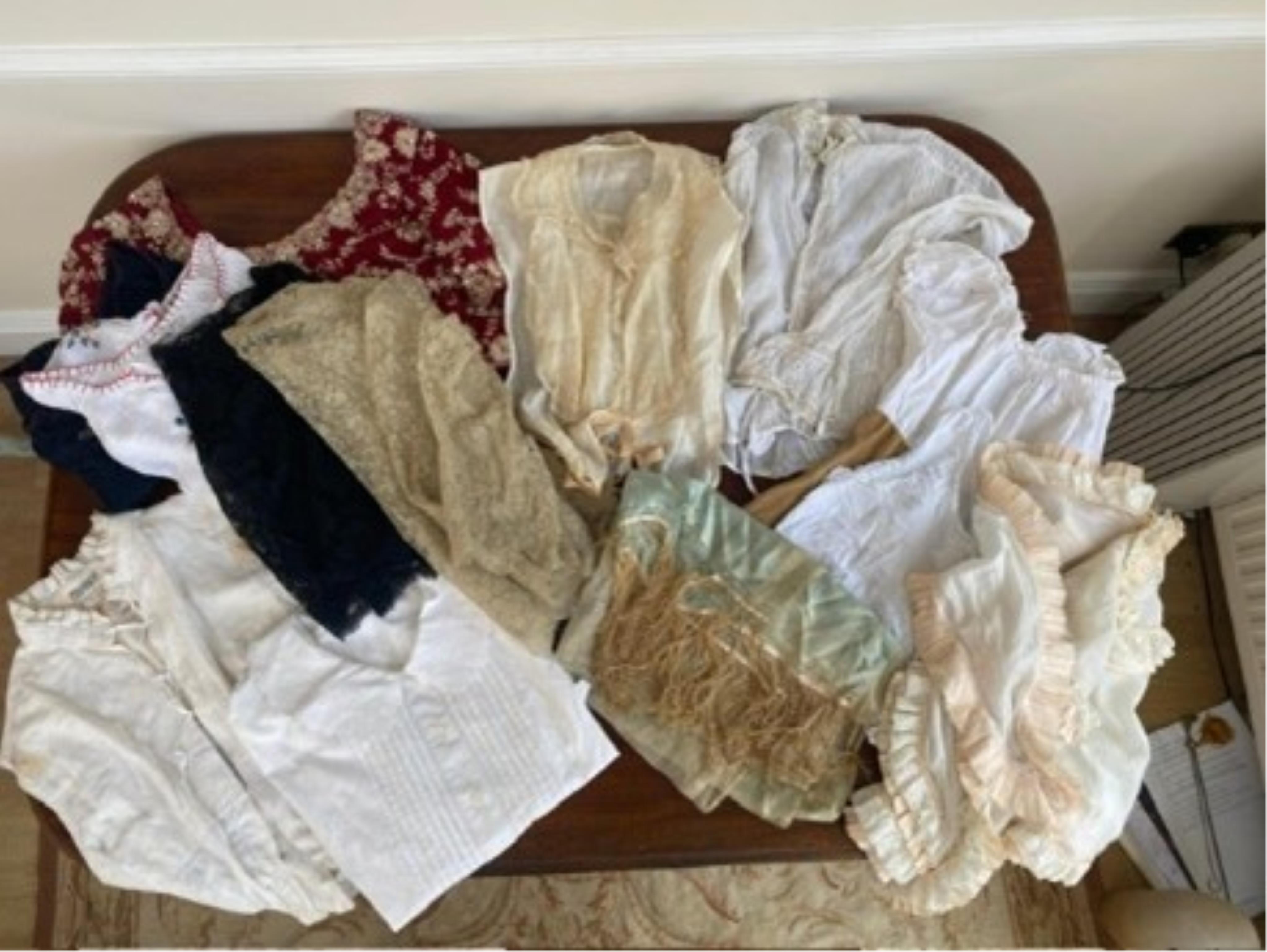 A vintage cotton night gown, a John Lewis night gown and over dressing gown with lace trim, plus mixed blouses some vintage and some with labels from the Royal Opera House